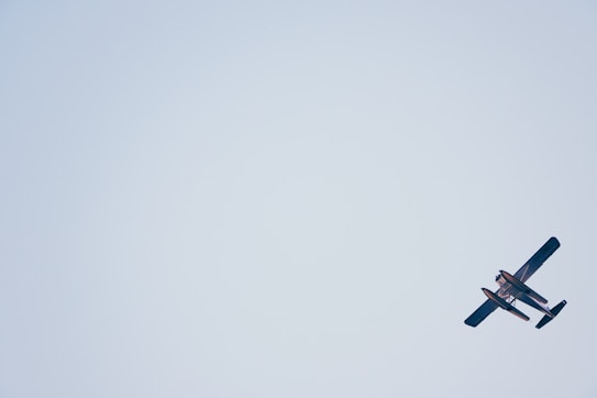 biplane on white sky