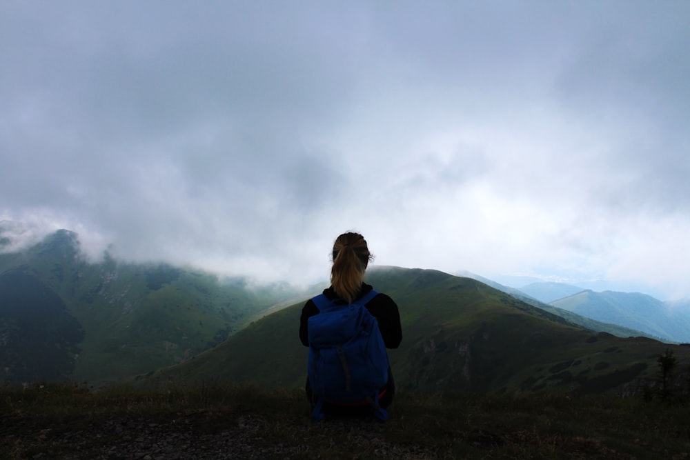 woman facing mountain with sea of clouds