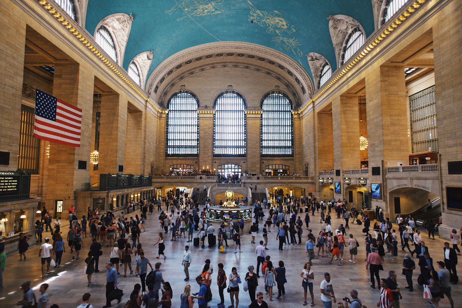Travel photograph: Grand Central Terminal's main concourse beneath its blue celestial ceiling as travellers cross the floor.