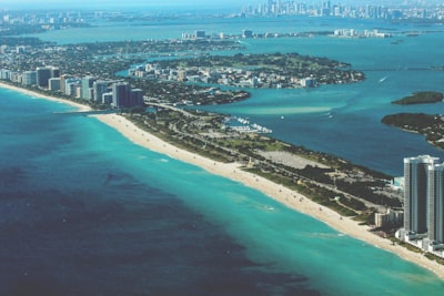 aerial photography of city at daytime miami teams background