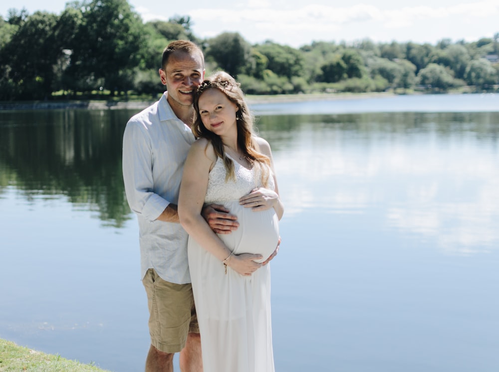 man holding woman tummy