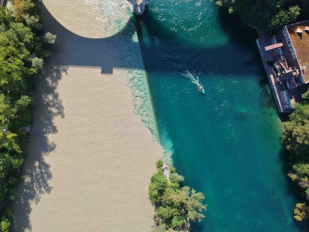 aerial view of boat sailing near house