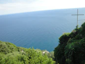 A panoramic view of Tenerife’s coastline with the Jesus Run logo subtly integrated into the sky.