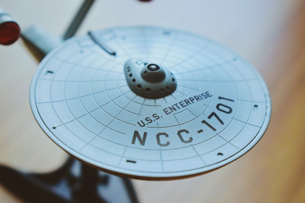 round gray USS Enterprise aircraft scale model