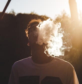 man in white shirt with white smoke concept photography