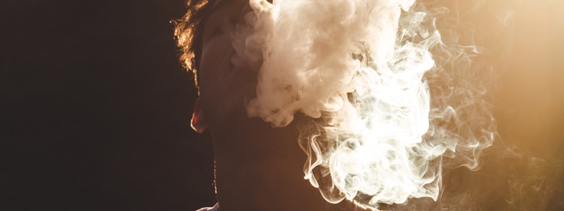 man in white shirt with white smoke concept photography
