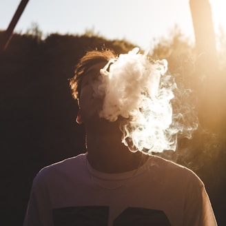 man in white shirt with white smoke concept photography