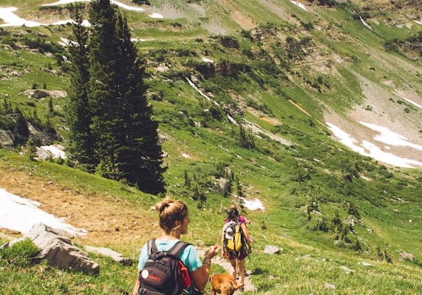 woman walking down the hill at daytime