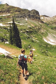 woman walking down the hill at daytime