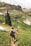 woman walking down the hill at daytime