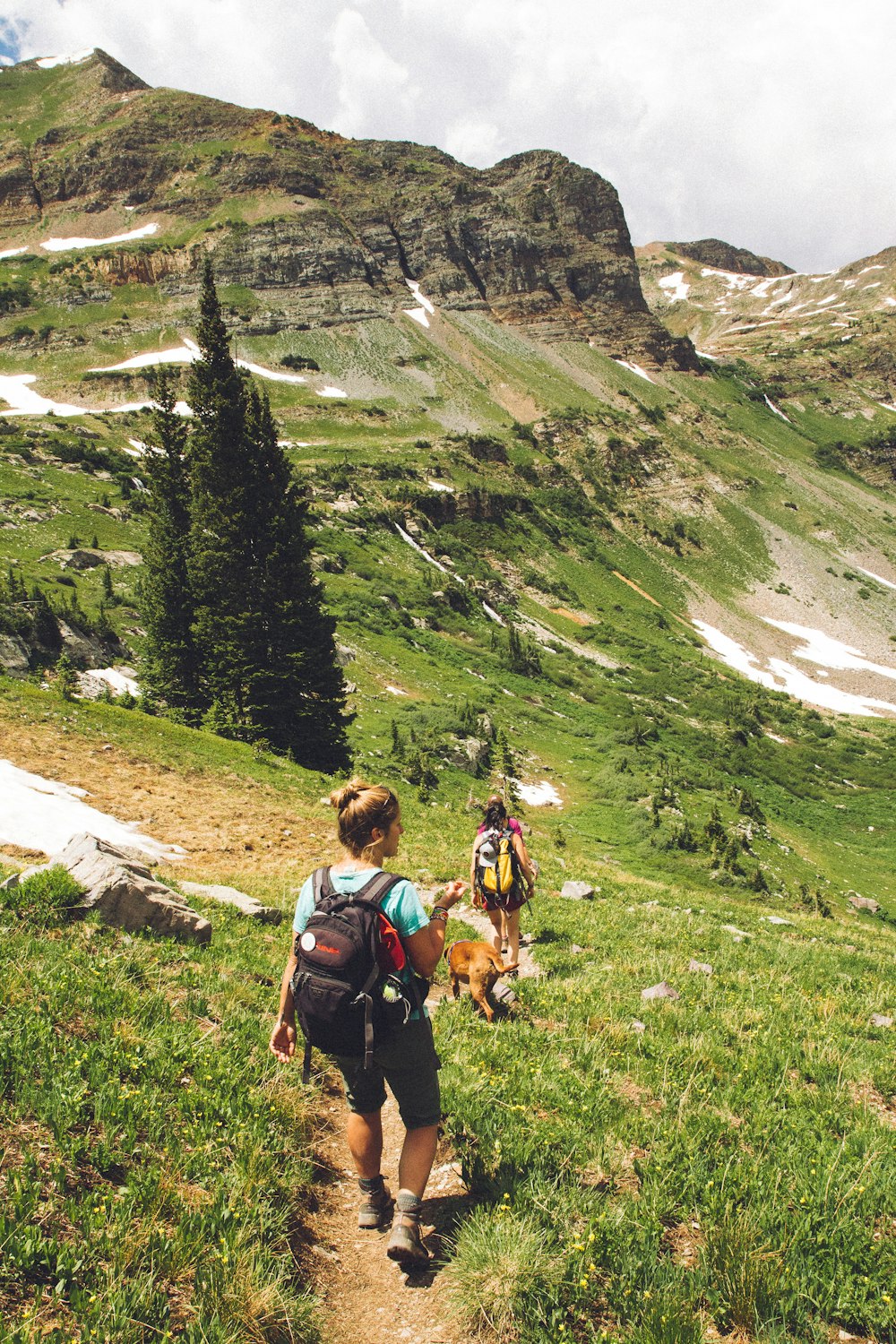 woman walking down the hill at daytime