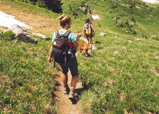 woman walking down the hill at daytime