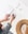 person holding ballpoint pen writing on white paper