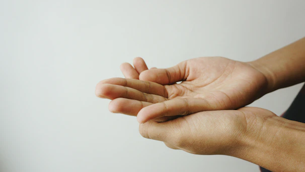 Graphic showing open hands holding a glowing data icon representing transparency