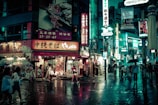people walking near buildings at night