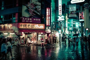 people walking near buildings at night