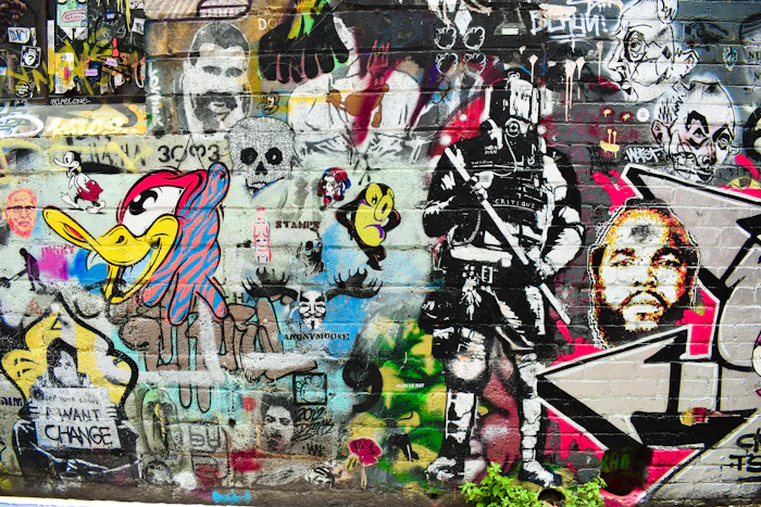 A wall covered in colourful street art in Melbourne