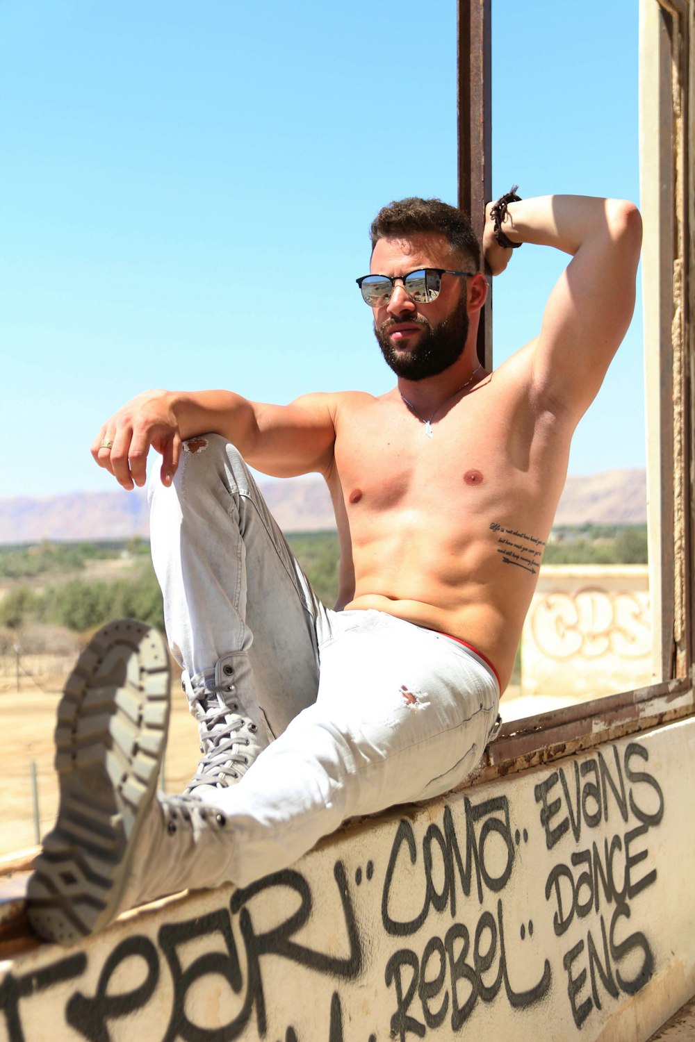 man sitting on window