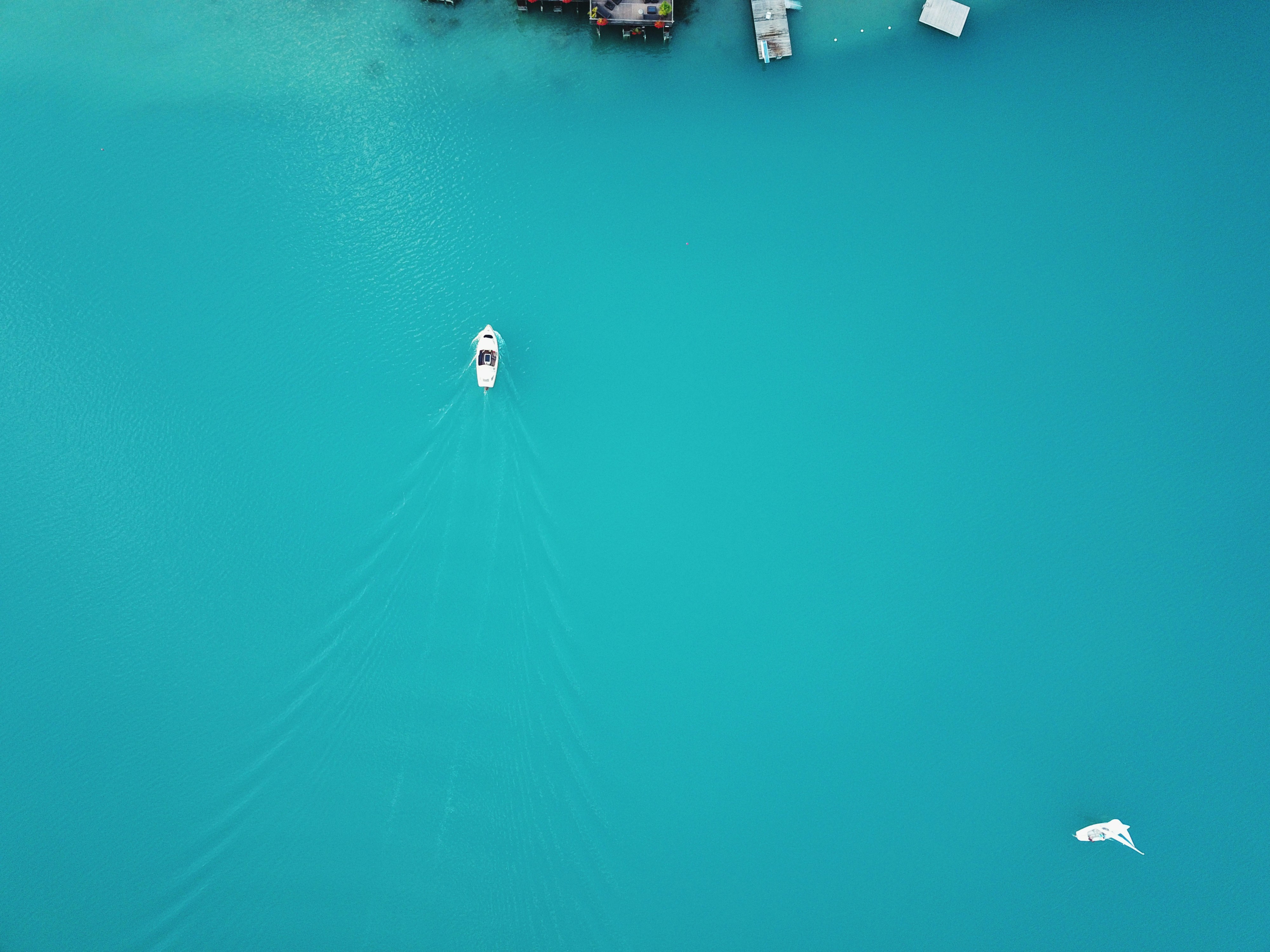 aerial photography of white boat on body of water at daytime, Boat from up top