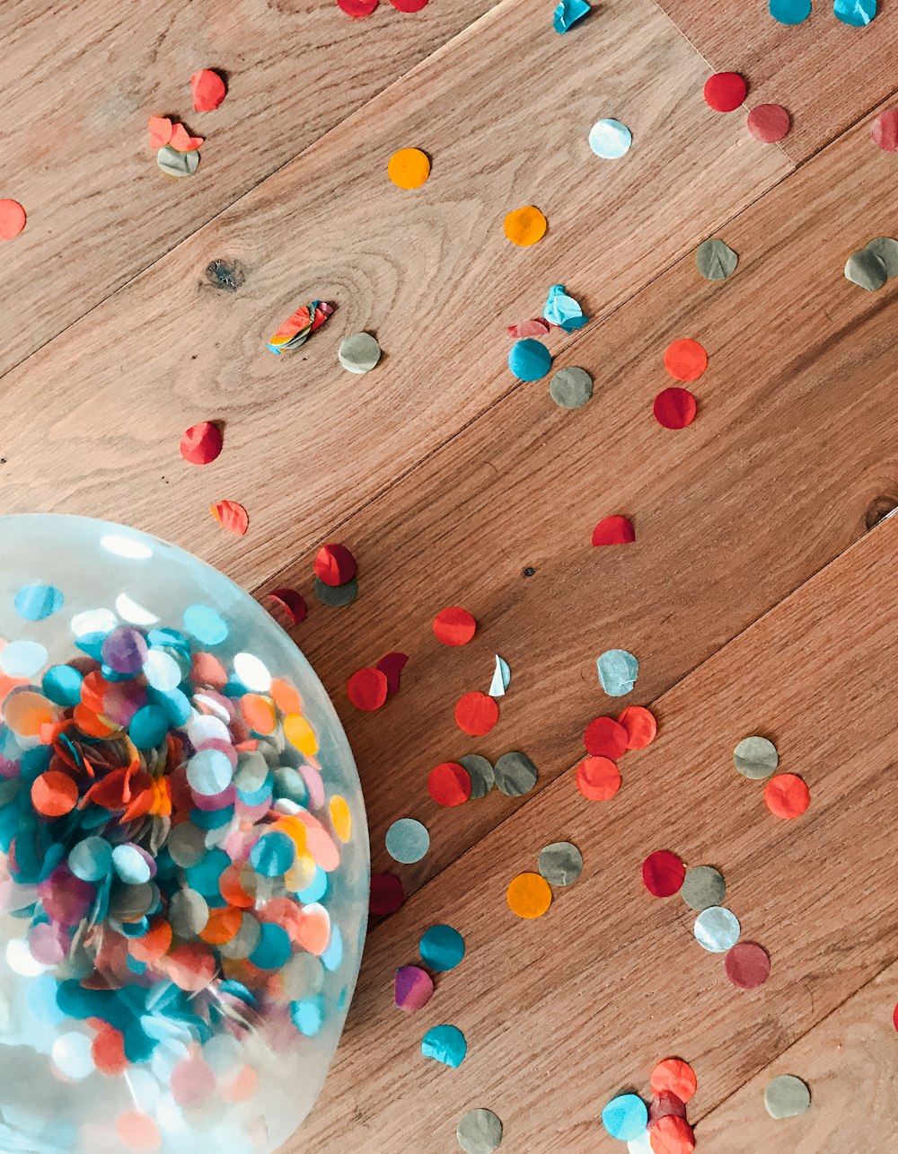 assorted-color of sprinkle dots on brown floor