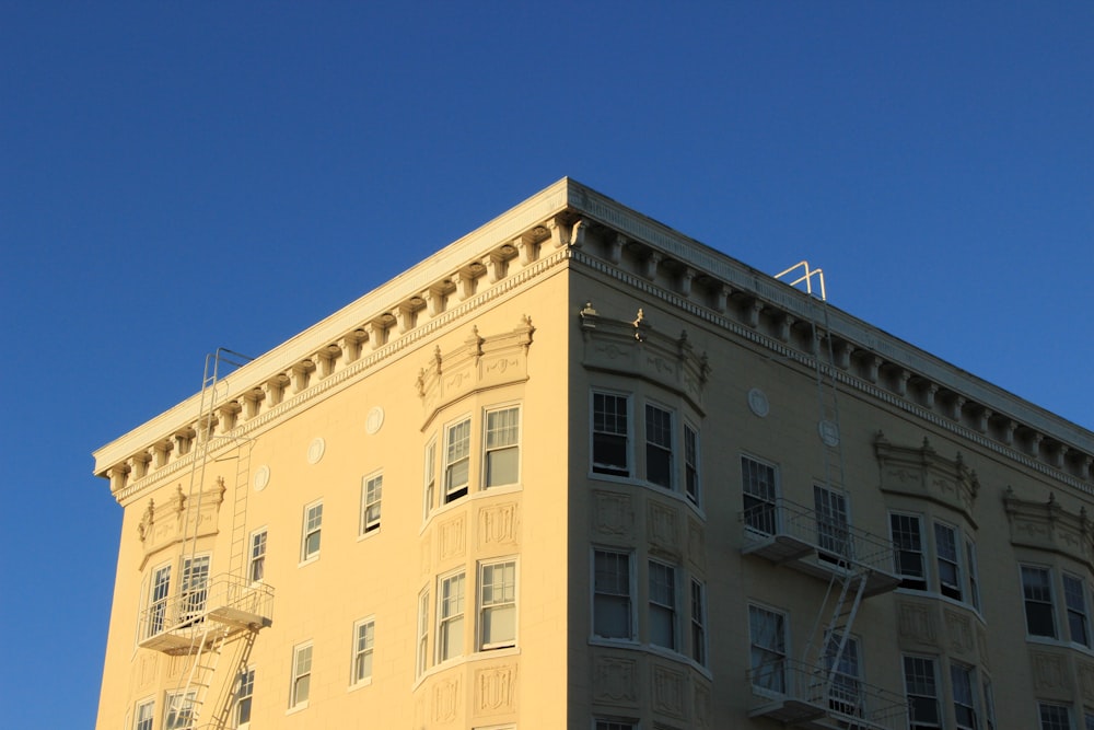 beige concrete building under blue sky