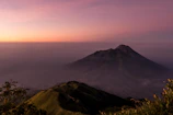 gray mountain under gray sky during sunset