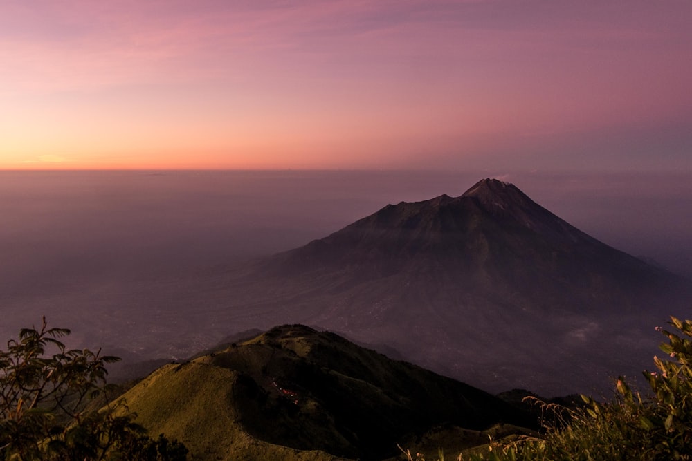 gray mountain under gray sky during sunset