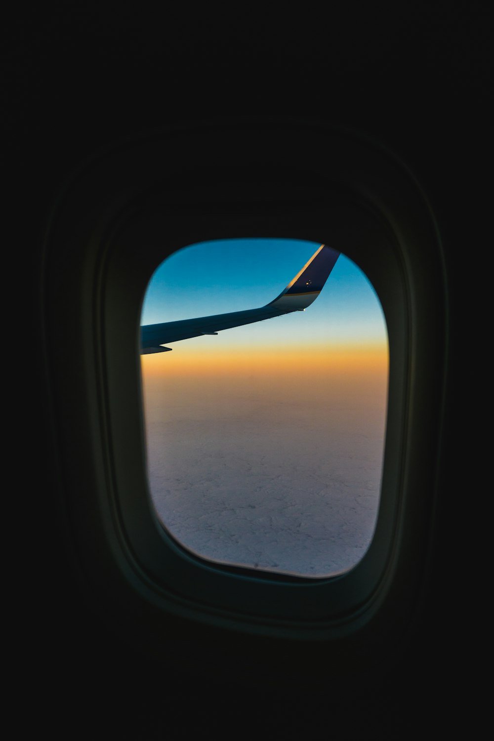 airplane window view of sky in travel photography