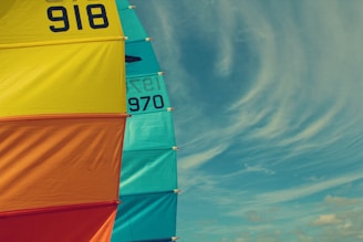 a colorful sail with a blue sky in the background
