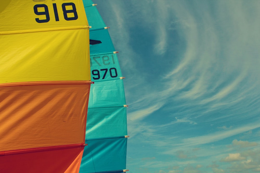a colorful sail with a blue sky in the background