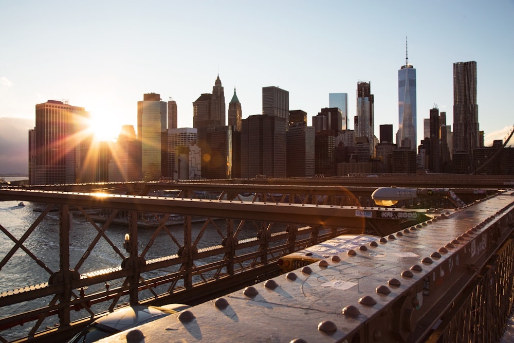 gray metal bridge over sunny morning