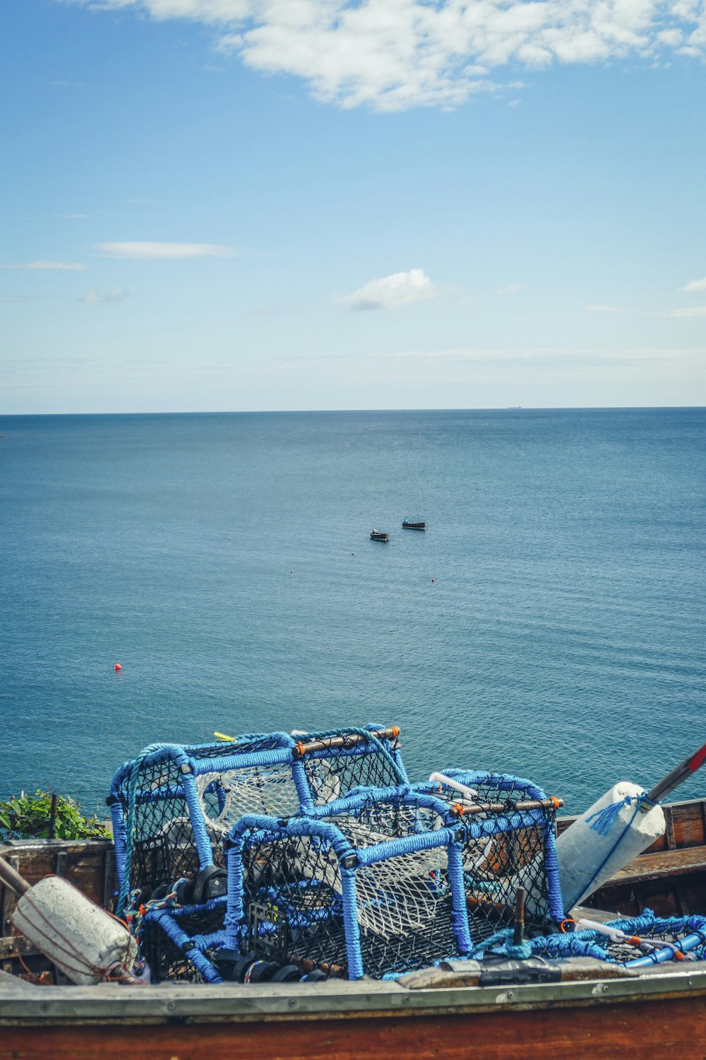 two fish nets on boat near sea