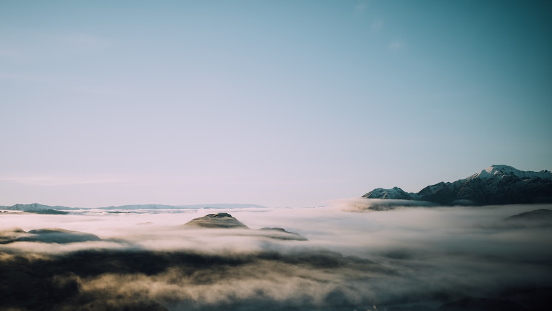 landscape photography of mountains covered with clouds