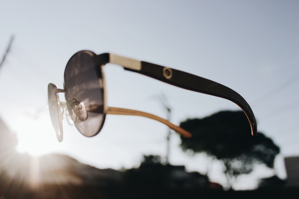 floating black and silver Aviator sunglasses