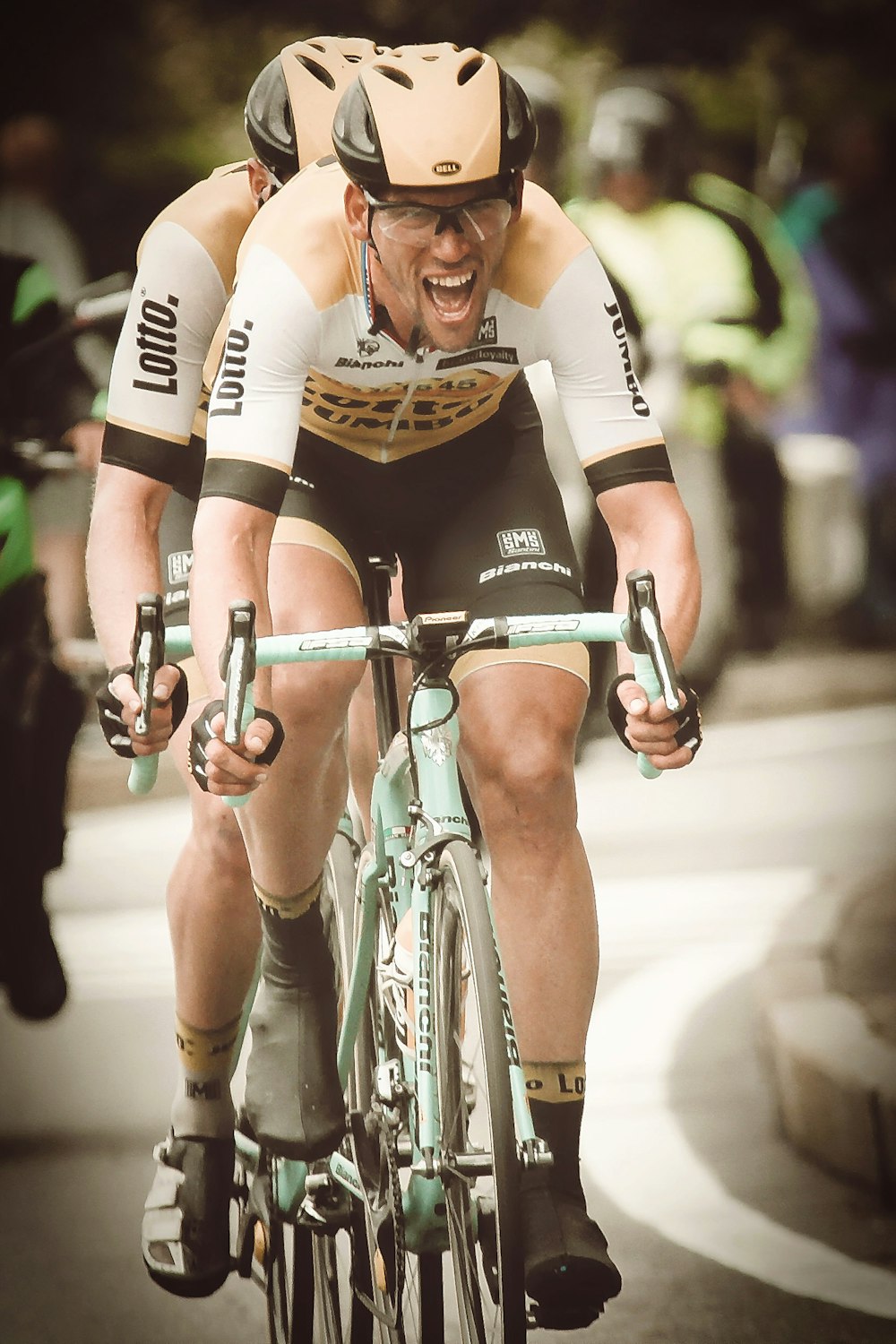 shallow focus photography of man riding bicycle