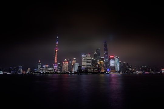 black concrete building during night time in Pudong Skyline China