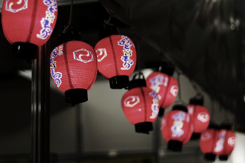 focus photography of red-and-blue chinese lanterns