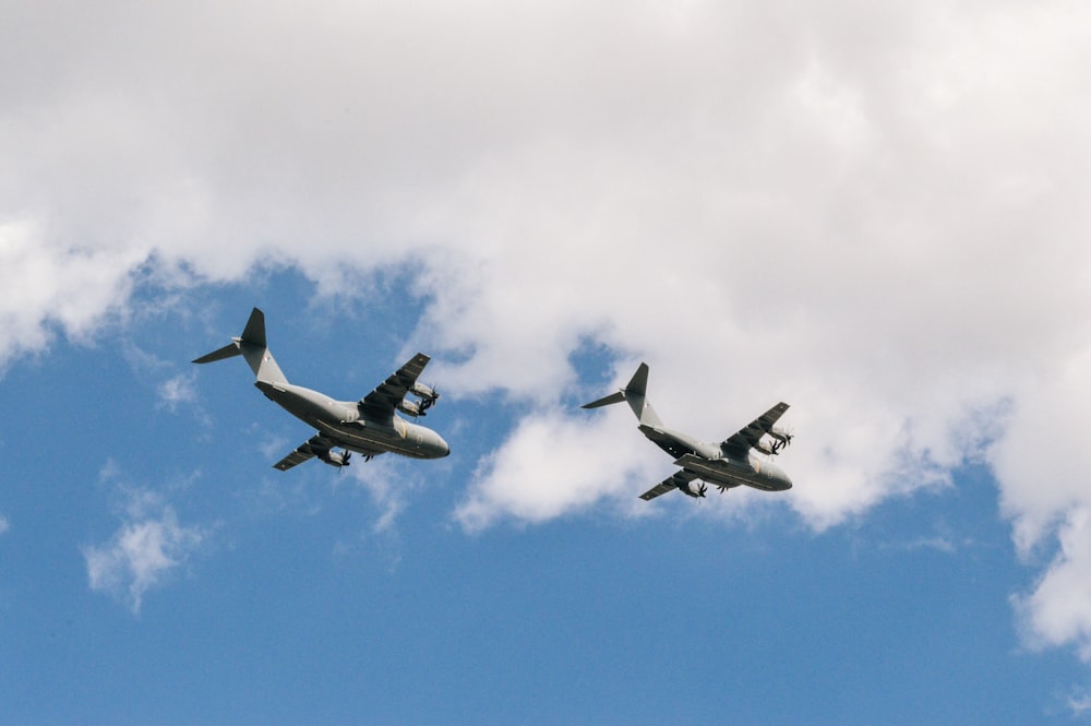 two white planes flying