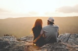Couple enjoying the scenic overlook at Pedra Redonda during a sunny adventure tour