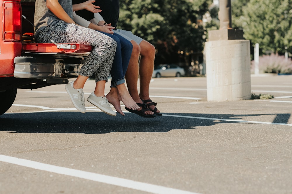 group of people sitting on truck bed