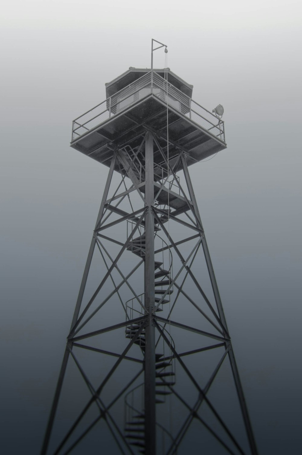 gray metal tower with curve stairs
