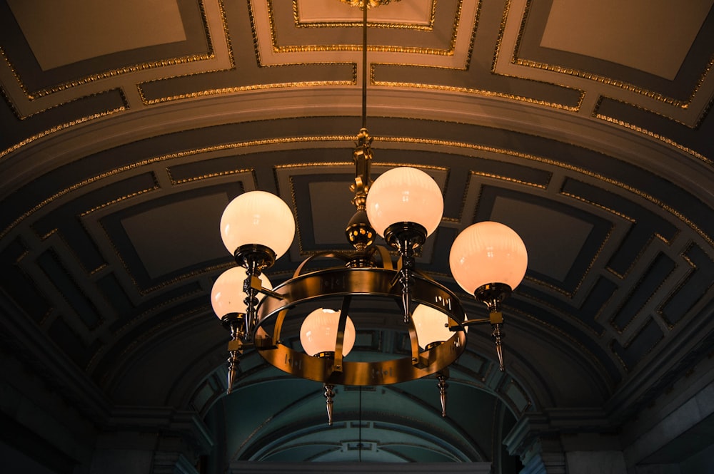 turned on black metal uplight chandelier