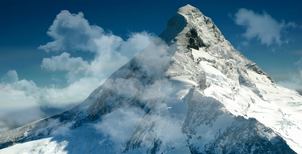 snow covered mountain under blue sky