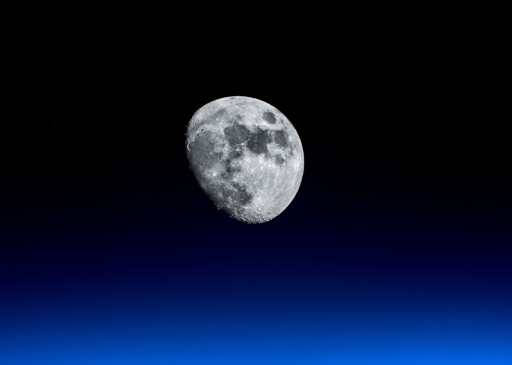 waning moon with black background