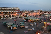 Lille's lively market square filled with locals and fresh produce stalls.