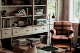 Cozy living room featuring weathered wood shelves filled with vintage knickknacks