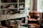 A cozy living room with a vintage chair that looks freshly restored.