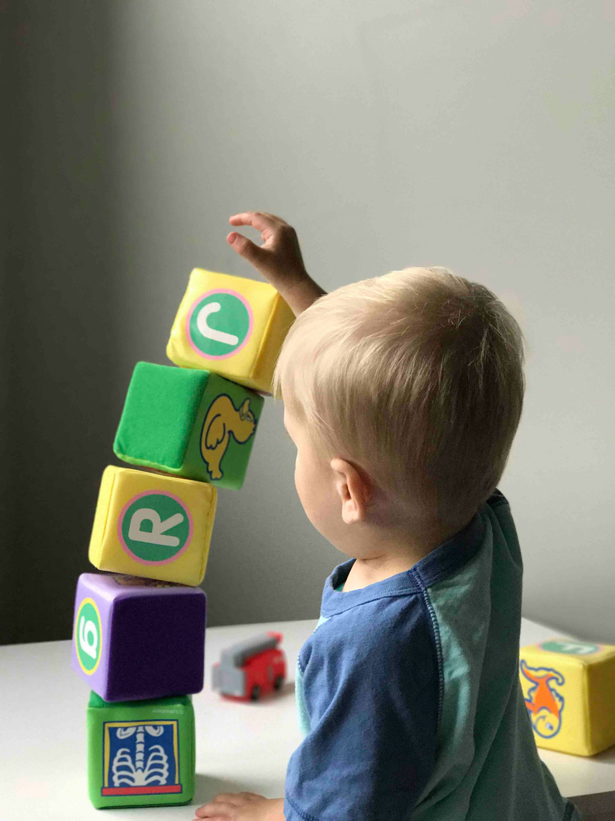 Baby building stack of blocks