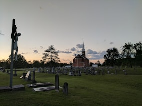 brown church near cemetery