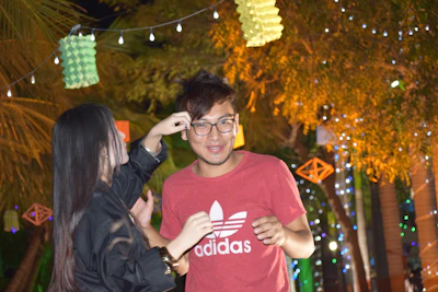 Smiling team members coordinating setup with decorations and lighting.